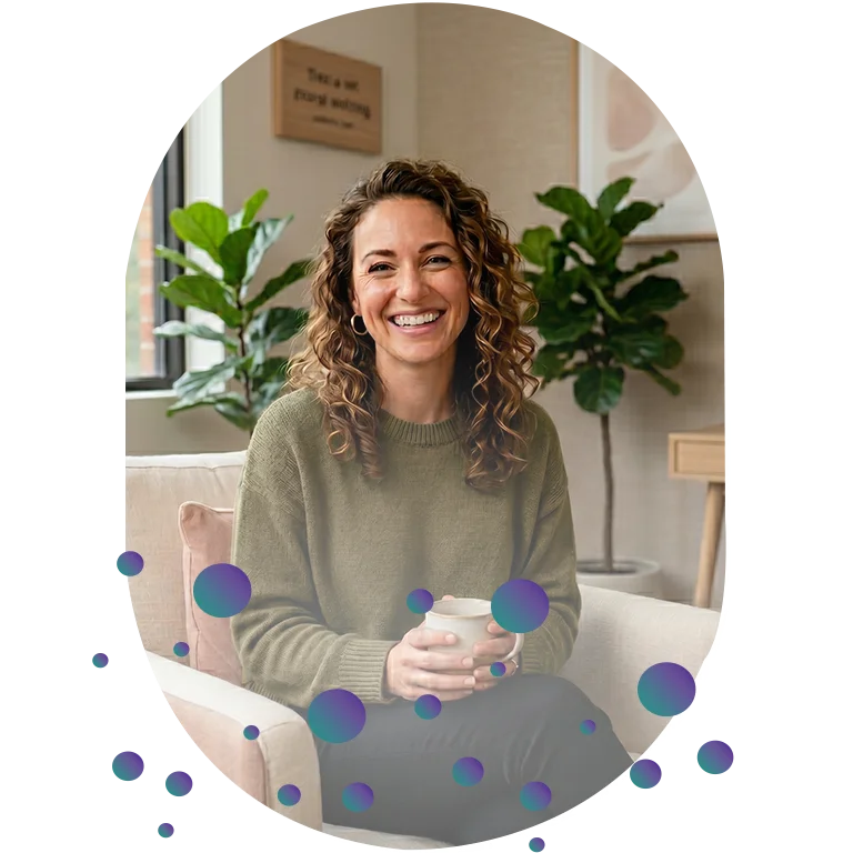 A woman smiling in a calm and welcoming space